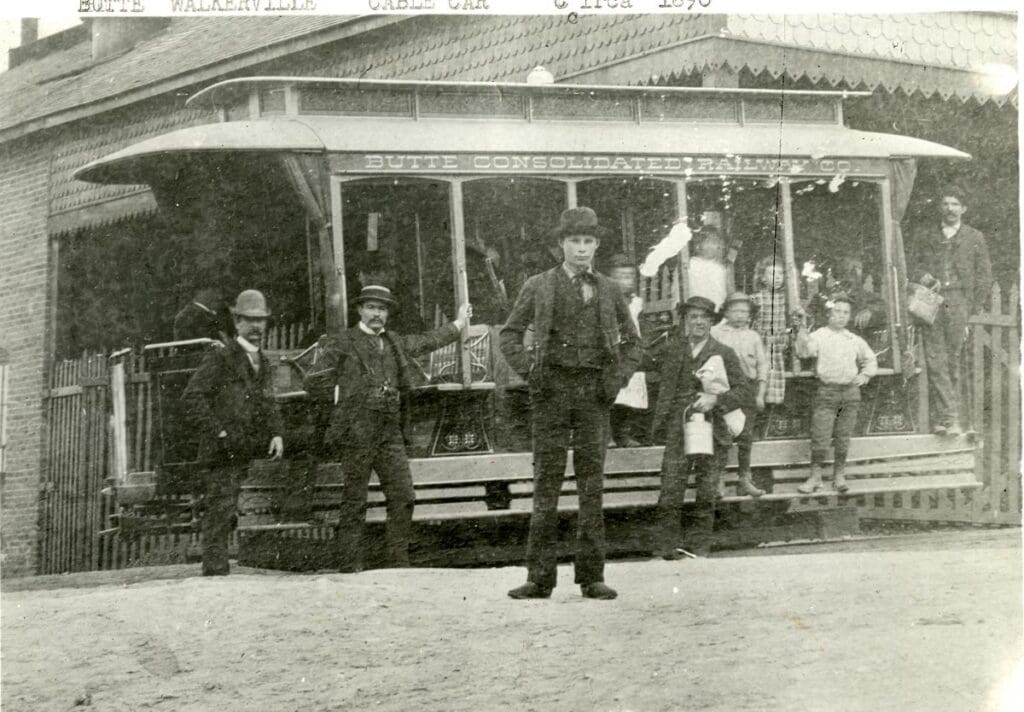 Butte and Walkerville cable cars. The cars ran from Park and Main Streets in uptown Butte to Walkerville (north of Butte). The Man in front is Ren Wells; the grip man is Nathaniel McTucker. Butte, MT Circa 1890