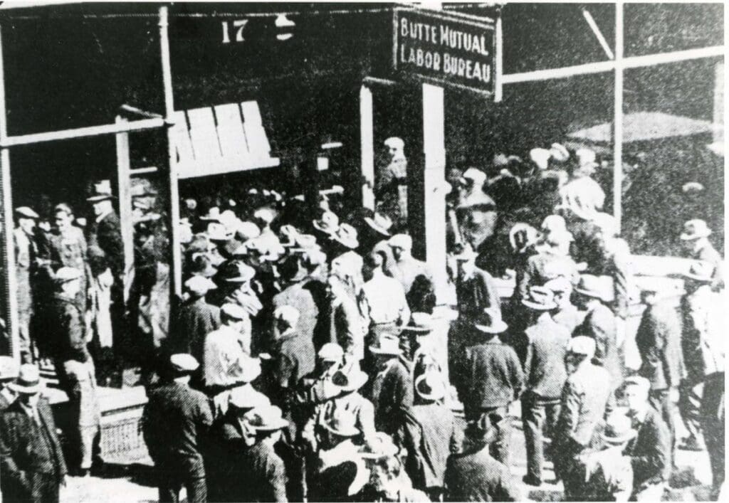 Following one of Butte's long strikes, miners crowd the Labor Bureau to secure "rustling cards" so they could get hired back to work. The Labor Bureau was at one time on East Quartz Street. Butte, MT. Circa 1936.
