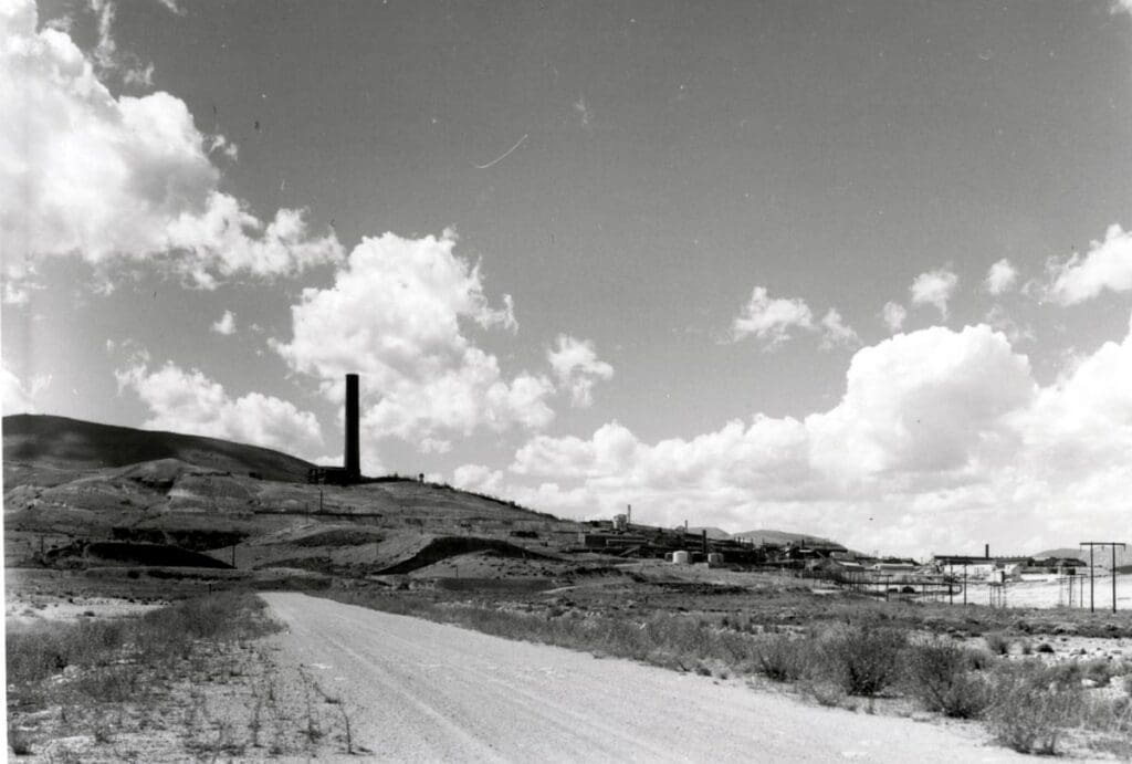 Smelters - Anaconda Smelter building being torn down for scrap. (Picture taken from the Mill Creek Road). August 22, 1982 Anaconda, MT